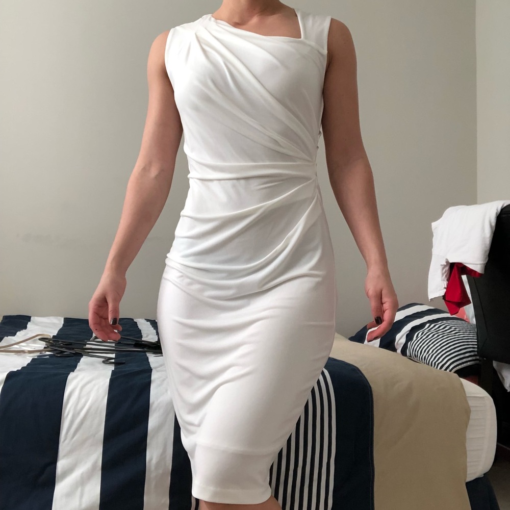 Knee length white sleeveless dress